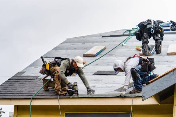 Professional Roofing technician working in Hague, VA